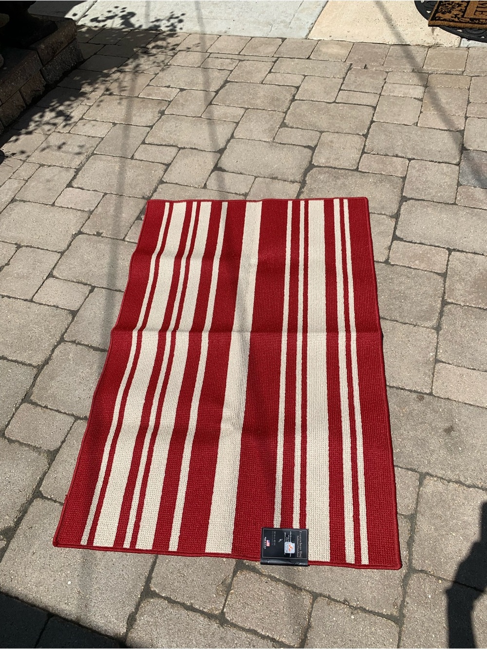 Red and Cream Striped Outdoor Rug. 30”x 46”
